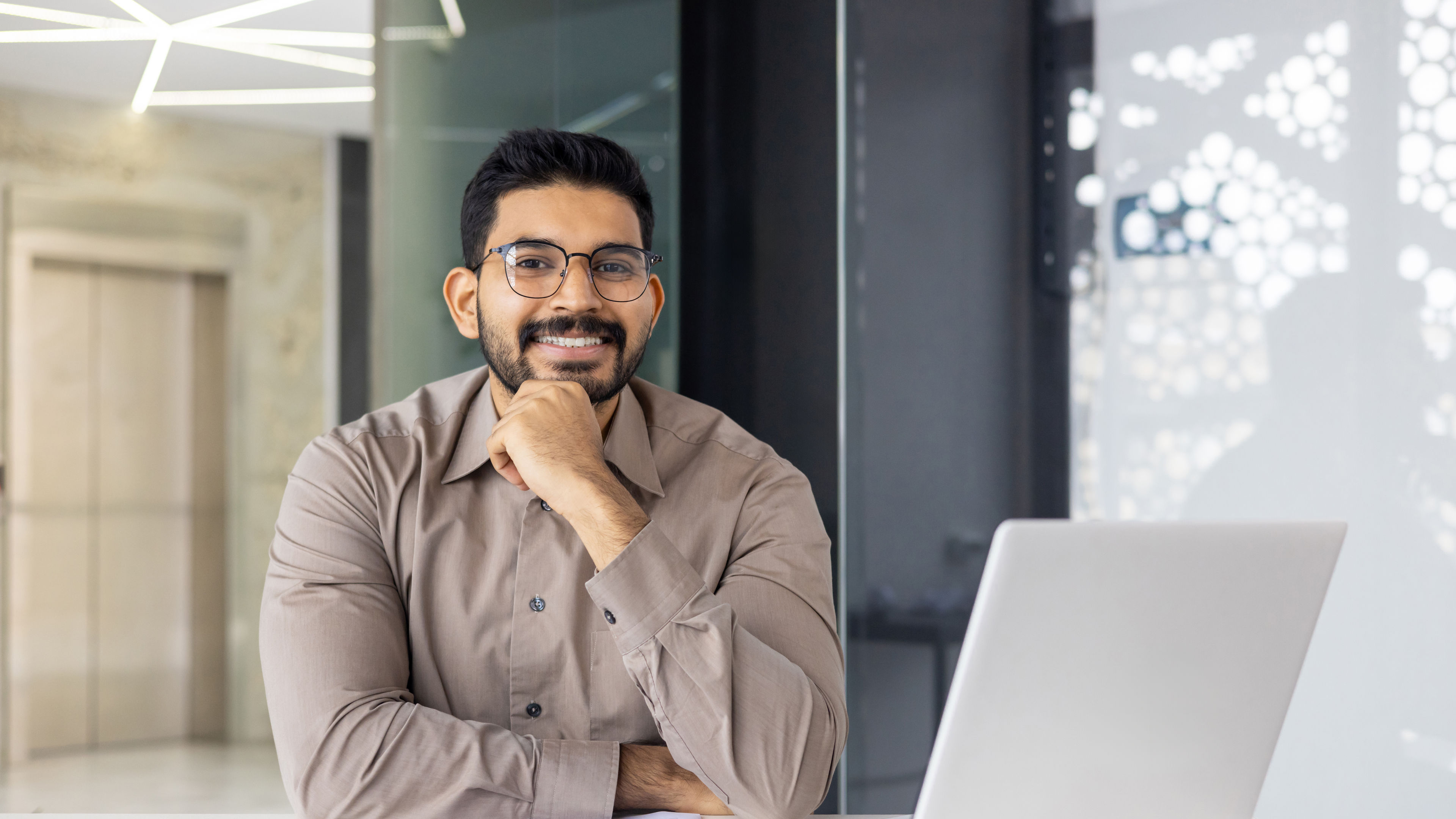 A business professional is diligently working in the office, utilizing modern technology and data.