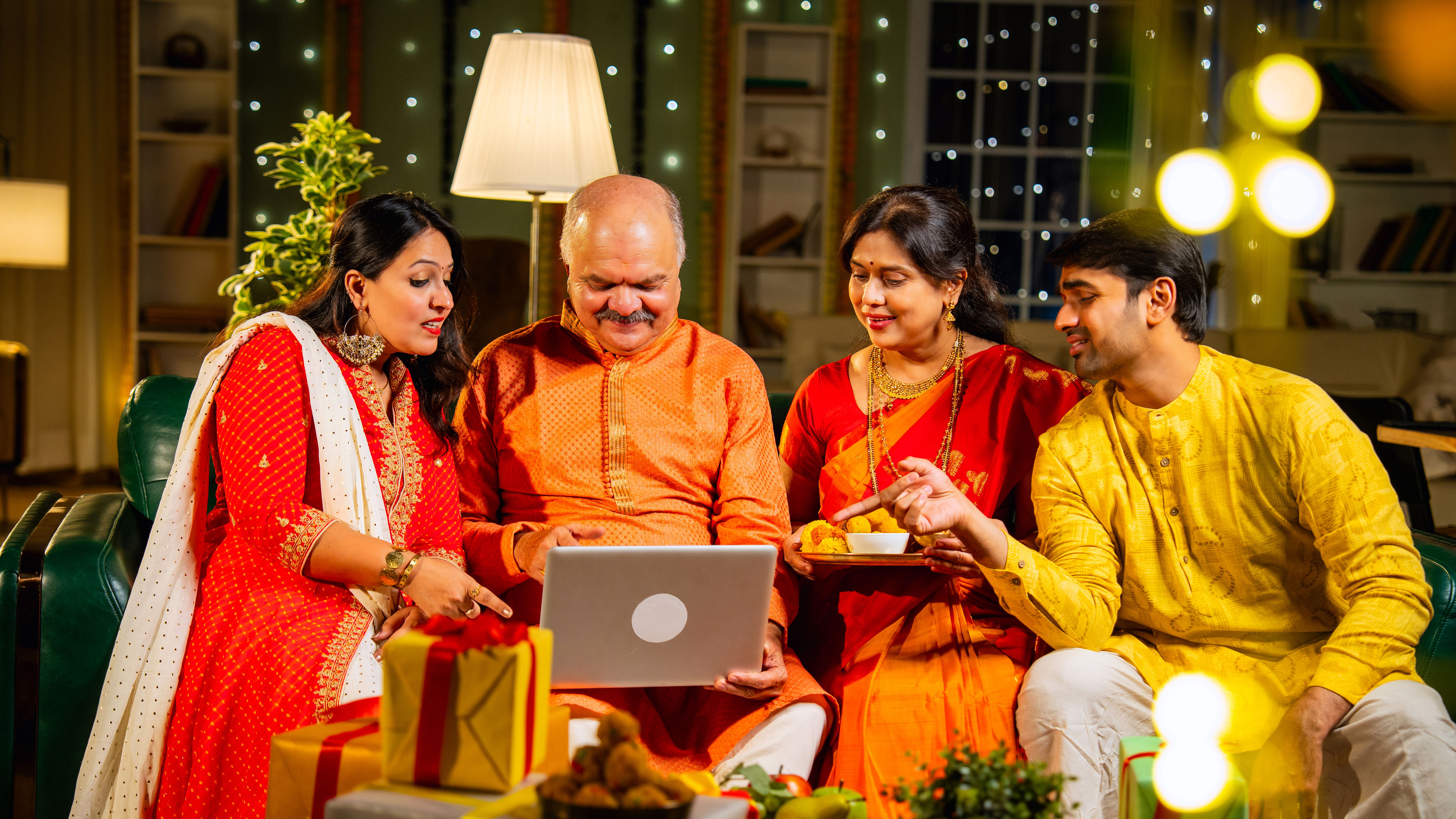 Family looking at laptop