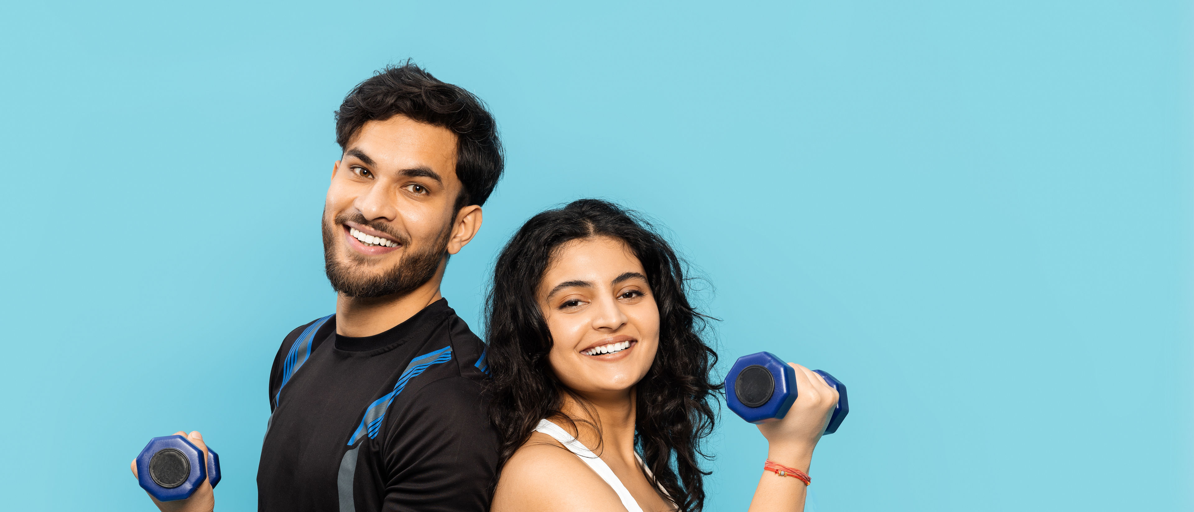 FITNESS COUPLE ENJOYING WORKOUT TOGETHER