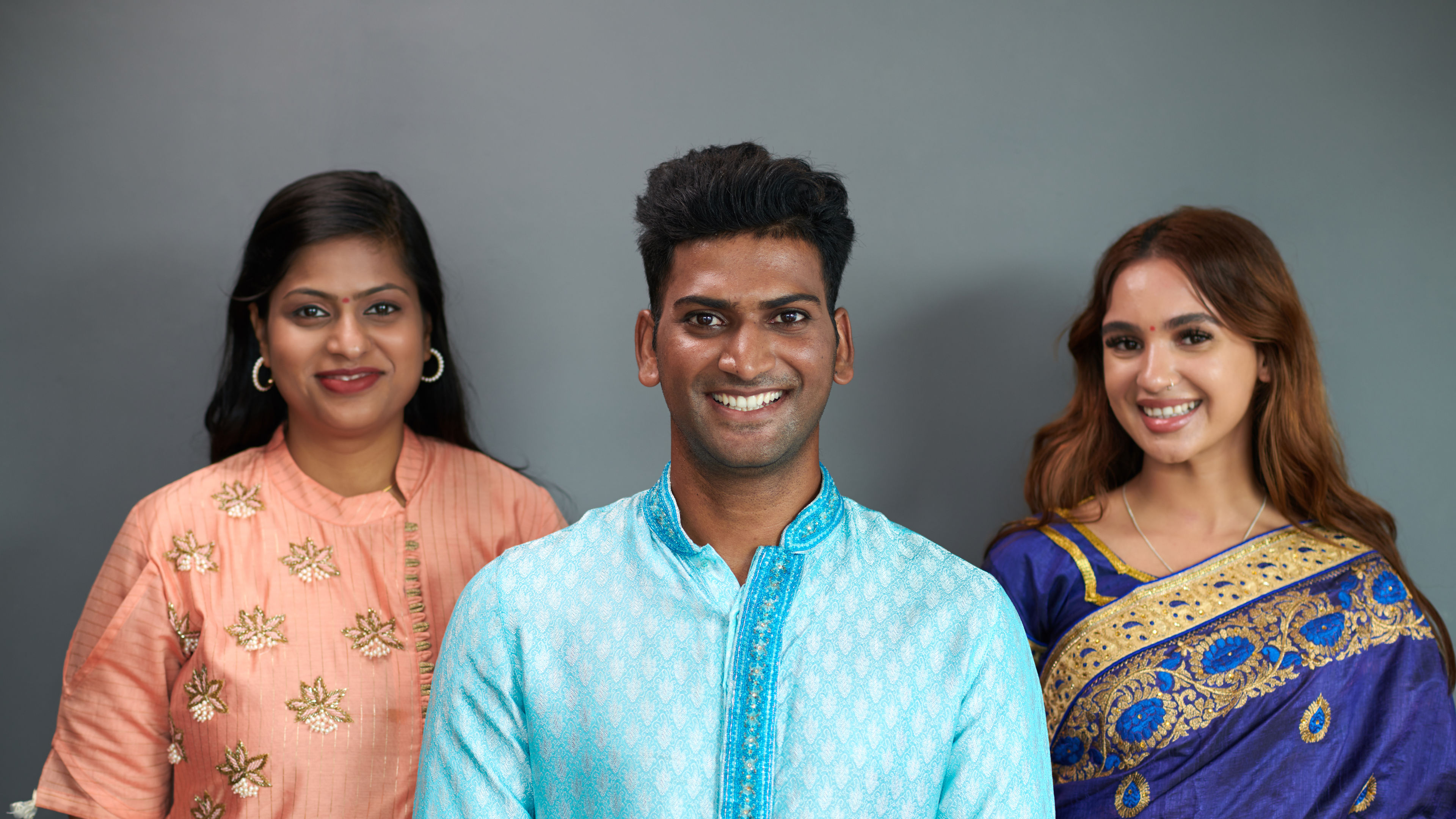 Portrait of happy Indian people in traditional costumes