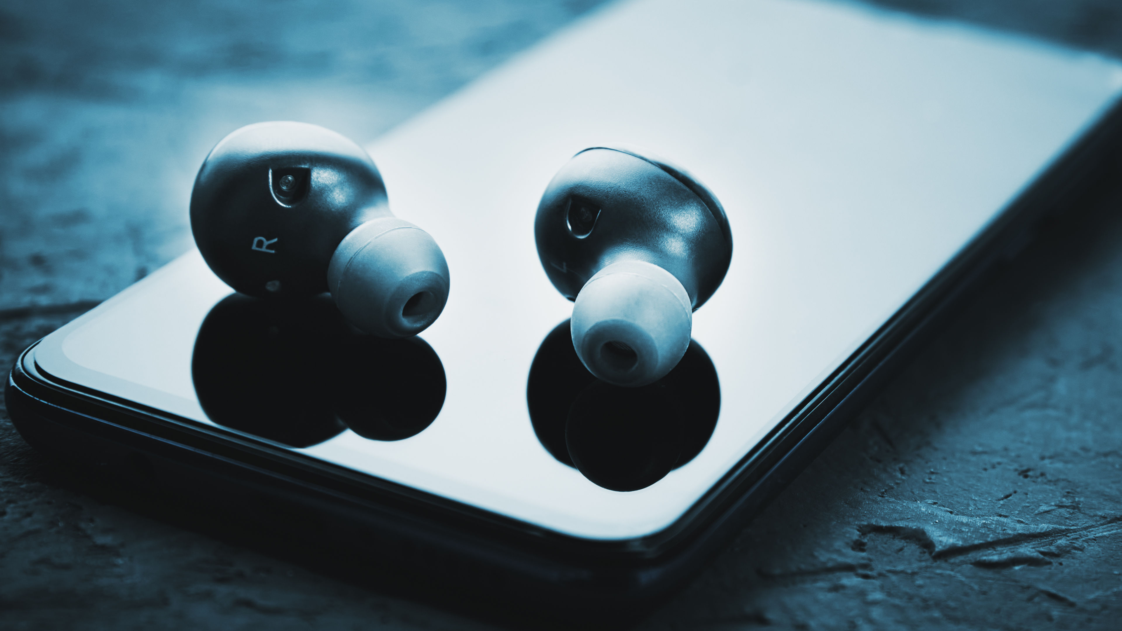 Wireless earphones on smartphone, Bluetooth headphones for listen audio