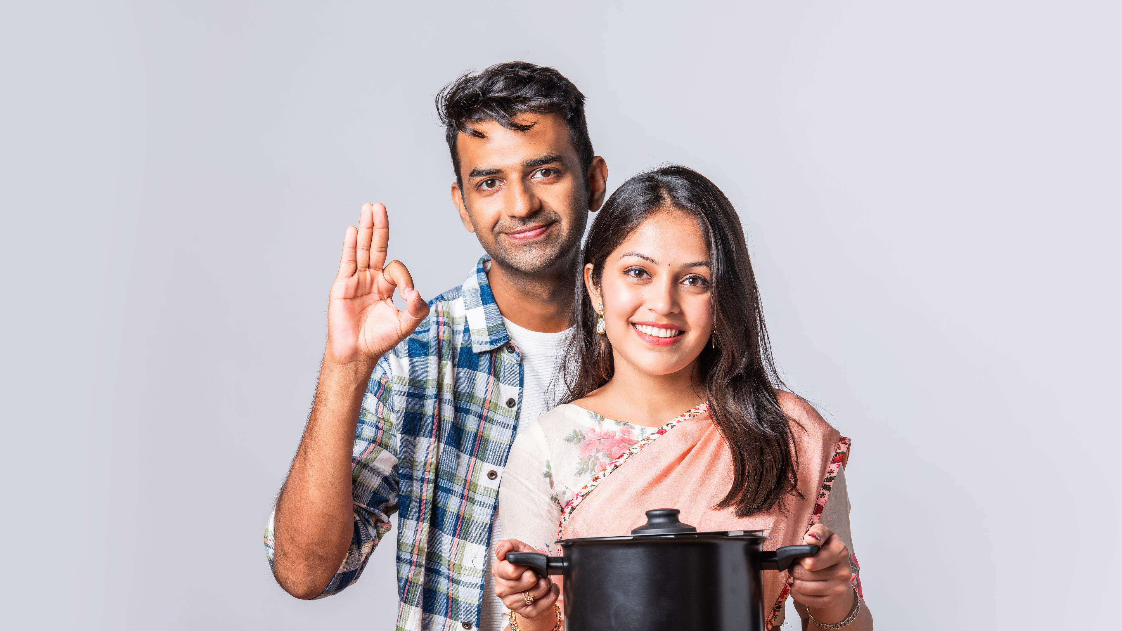 Woman holding Cookware 